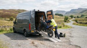 A motorcycle being loaded into a van, part of the UK motorcycle scrapping process